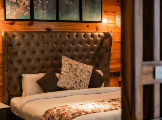 A luxurious premium cottage in Kasauli with a stunning valley view, surrounded by lush greenery and serene landscapes.